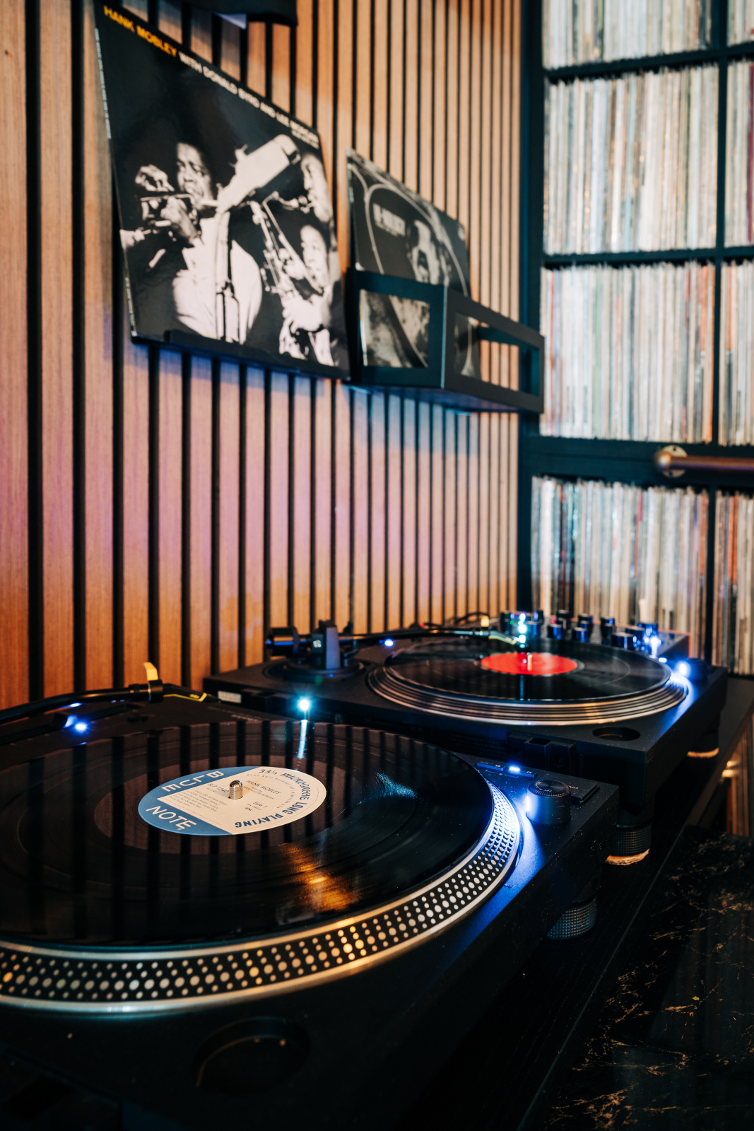 Kissa Kissa vinyl listening bar at night — warm glow and jazz atmosphere on Franklin Avenue in Crown Heights Brooklyn