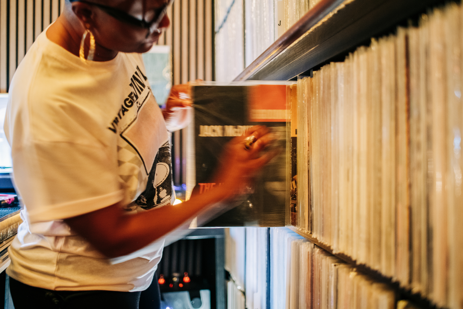 Guest browsing jazz vinyl at the Record Adoption Center inside Kissa Kissa listening bar, Crown Heights Brooklyn
