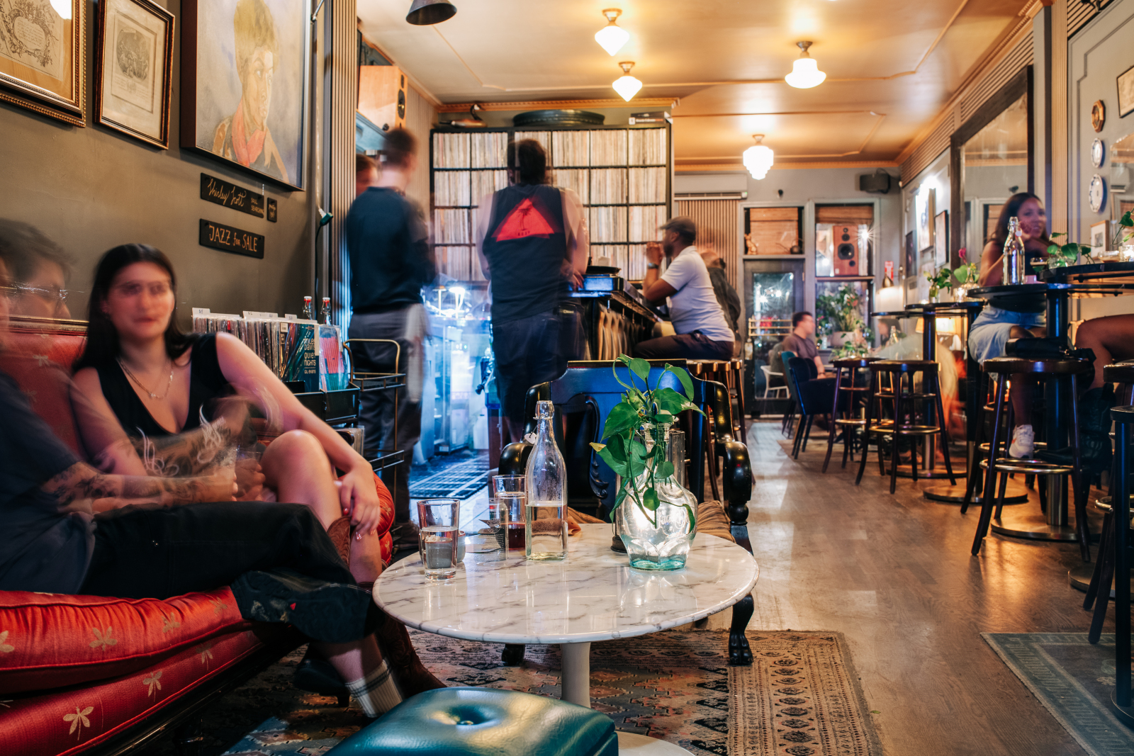 Interior of Kissa Kissa vinyl listening bar in Crown Heights Brooklyn — warm lighting, intimate seating, and audiophile sound system designed for jazz