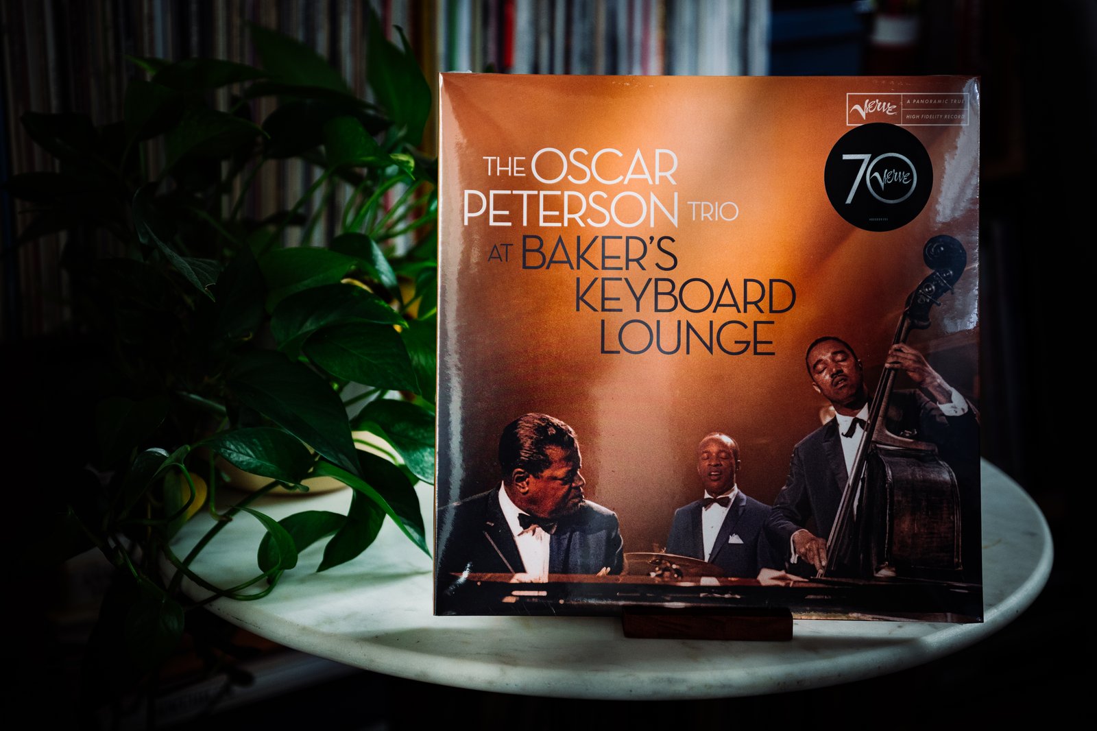 The Oscar Peterson Trio At Baker's Keyboard Lounge 3LP gatefold album displayed on a side table with plants at Kissa Kissa jazz kissa in Brooklyn