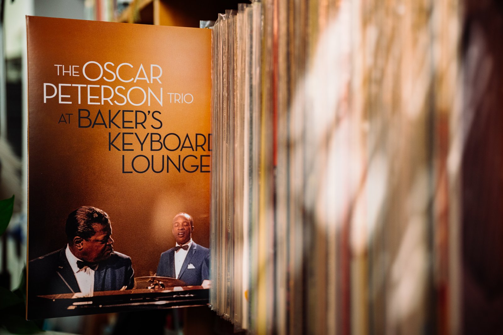 The Oscar Peterson Trio At Baker's Keyboard Lounge Verve Records 3LP propped in the record stacks at Kissa Kissa, surrounded by the bar's 5,000-LP jazz library in Crown Heights Brooklyn