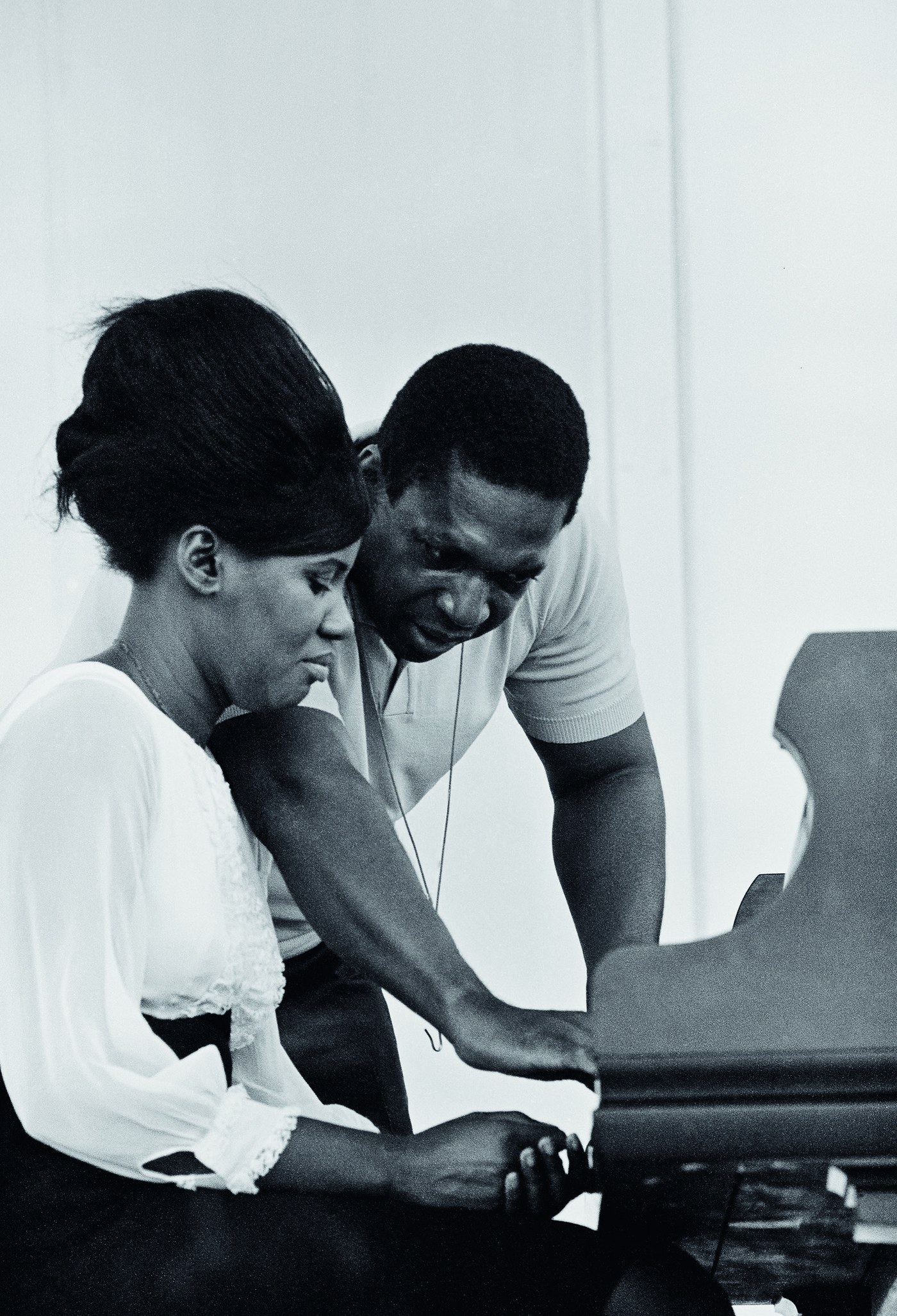 John and Alice Coltrane at the Newport Jazz Festival in Rhode Island, 1966, photographed by Joe Alper