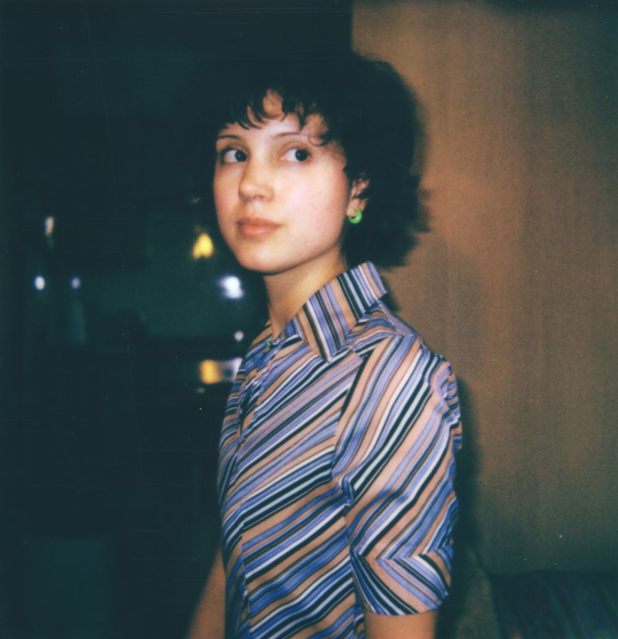 Portrait of Liana Flores from the And so it goes... press kit, photographed by Sophia Poole